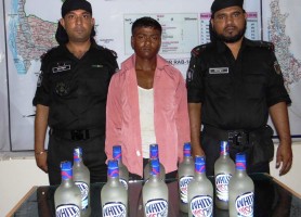 rab held alcohol trader in sherpur